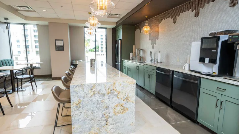 Modern communal kitchen with island seating for informal meetings